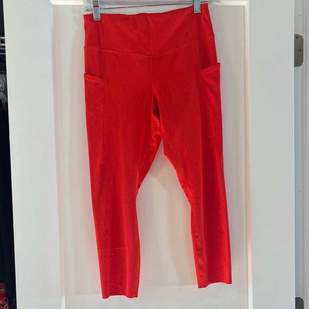 Vibrant Red Workout Leggings with laser cut outs and Pockets